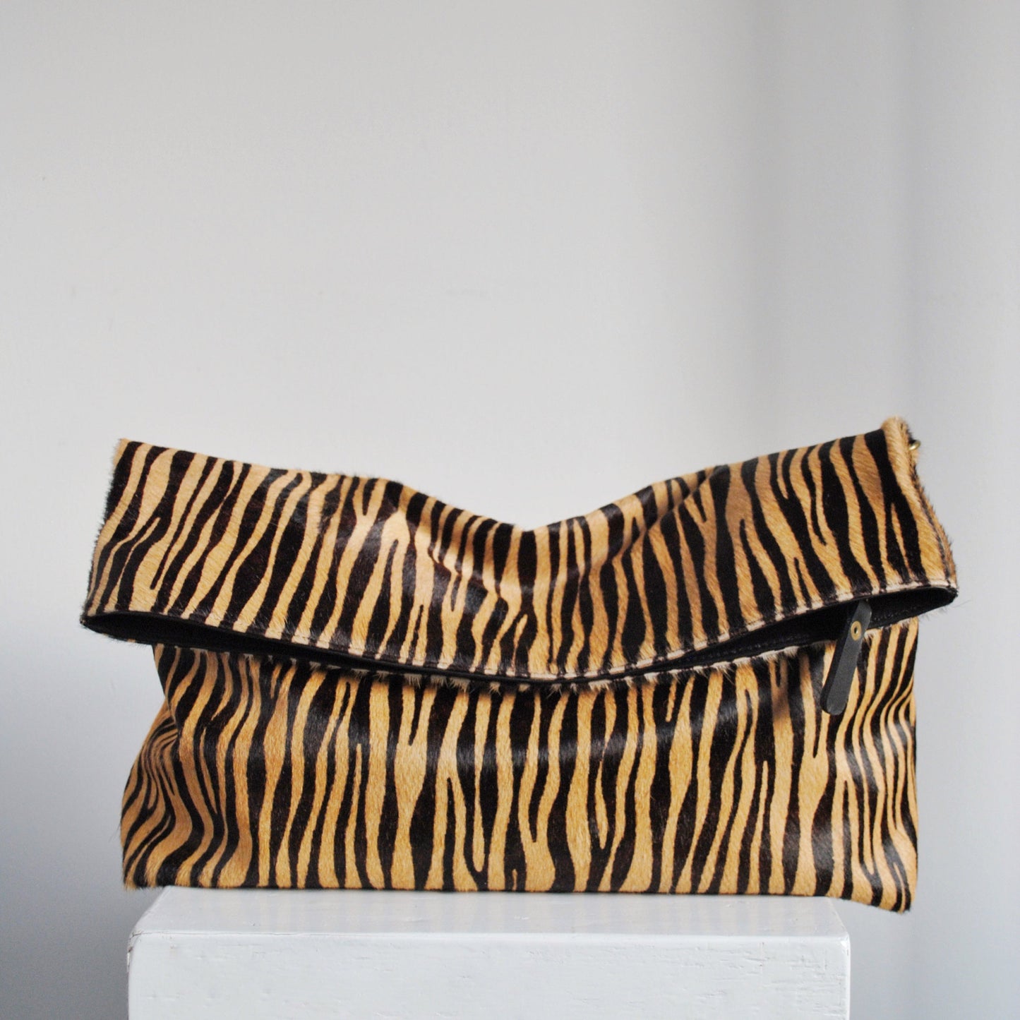 Clutch Tana Pelo Print